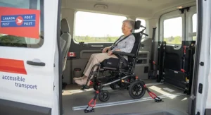 Secure transport of a tilt-in-space wheelchair inside an accessible Canadian community transit van.