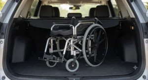 A foldable heavy-duty wheelchair showing compact storage for easy transport.