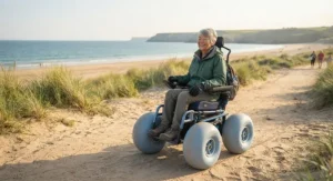 Illustration of an all-terrain wheelchair for outdoor use designed with wide wheels for sandy coastal paths.