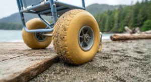 Close-up of balloon wheels on a specialized beach wheelchair engineered for effortless movement across sand and boardwalks on the British Columbia coast.