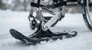 Close-up view of a front ski wheelchair snow attachment for wheels designed for deep snow and slush.